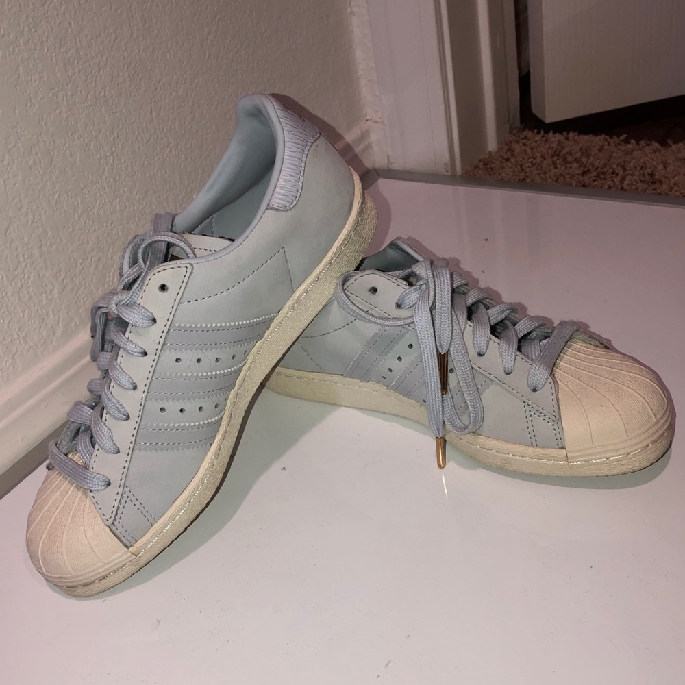Adidas light blue Superstars